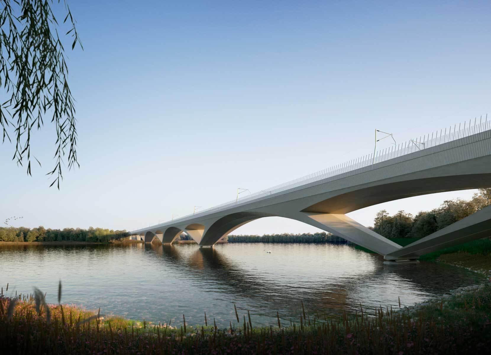 Curved concrete forms supporting a modern bridge over water