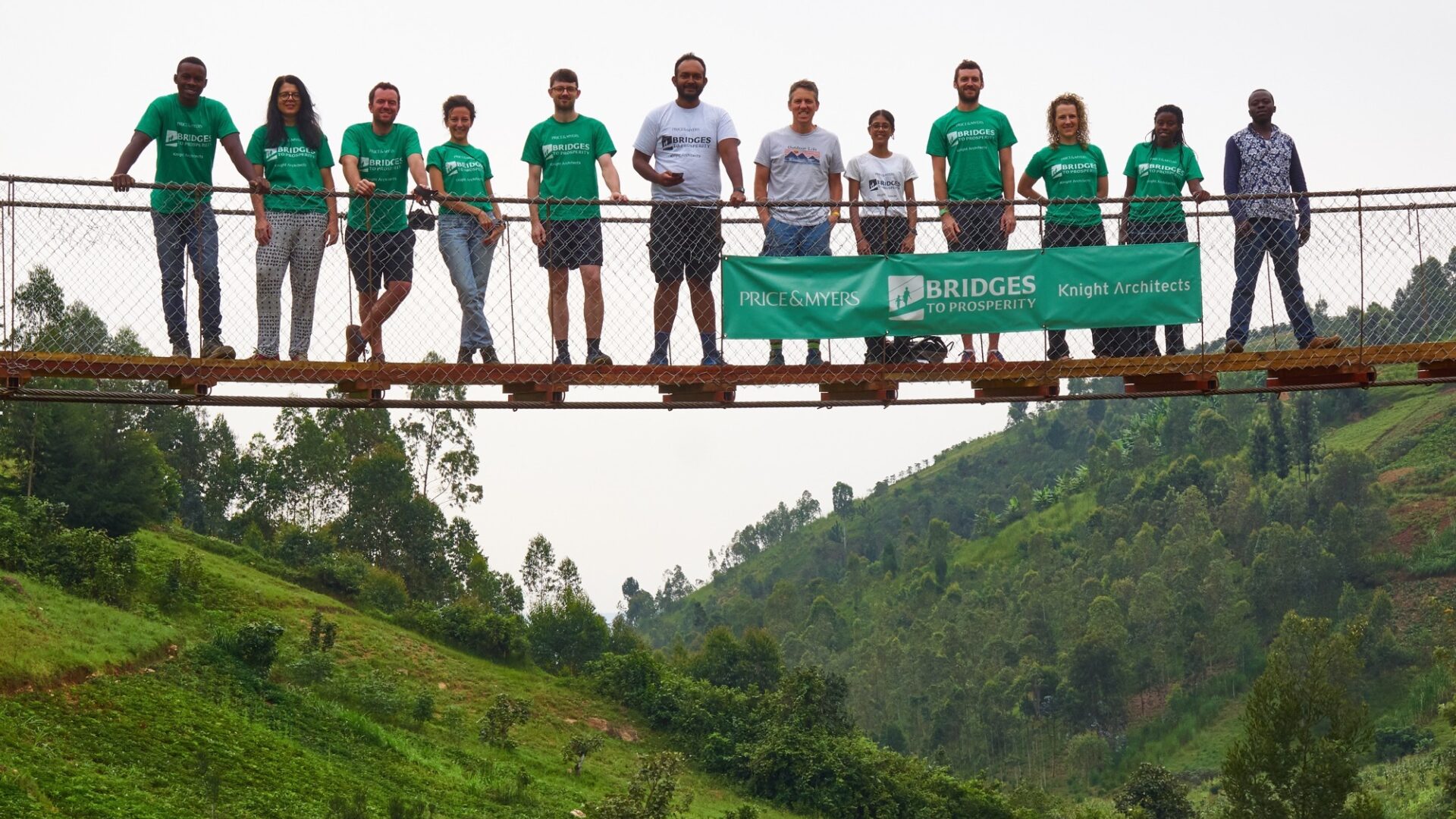 Bridges to Prosperity team posing for photo on bridge