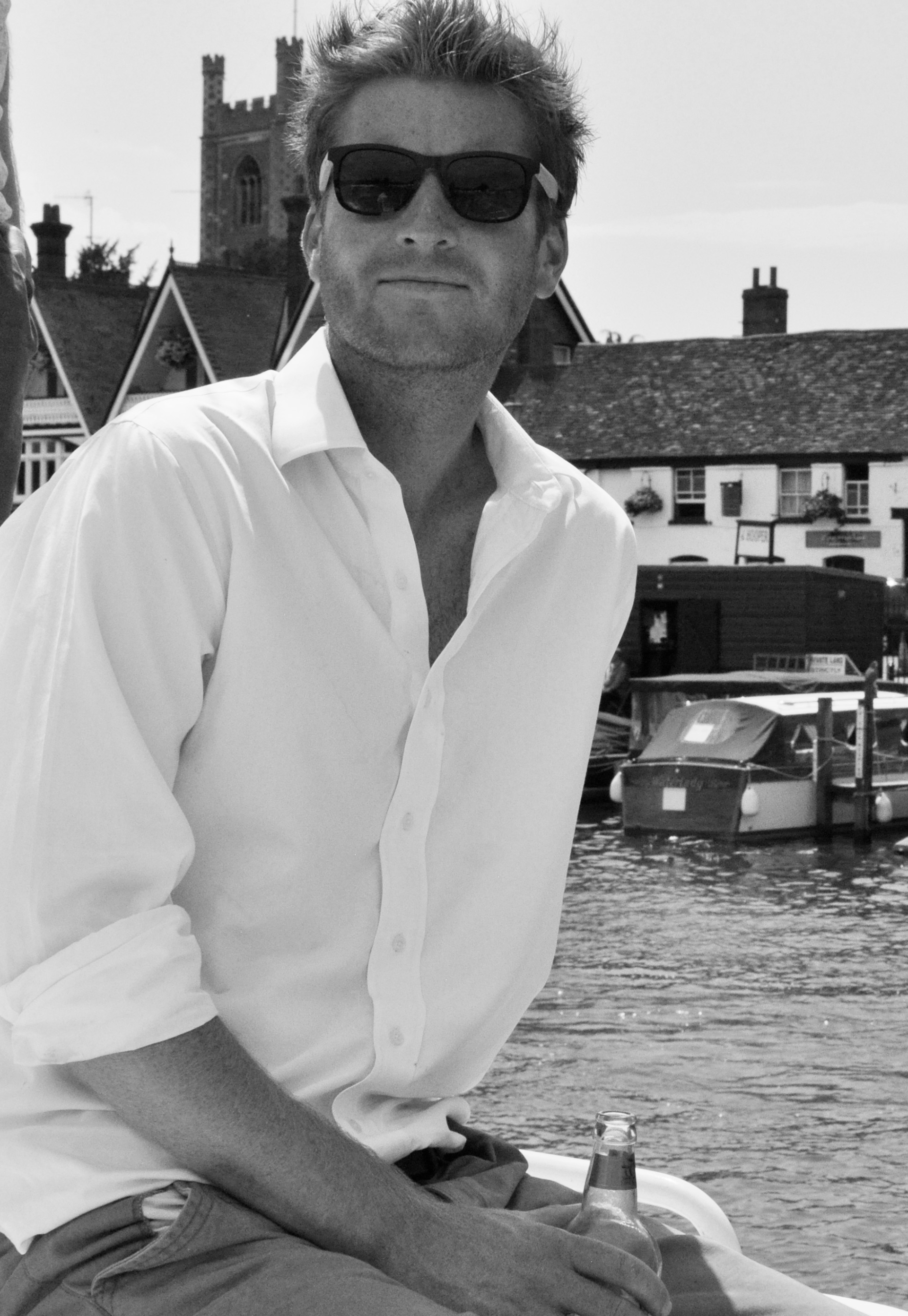 Sam White in sunglasses and shirt