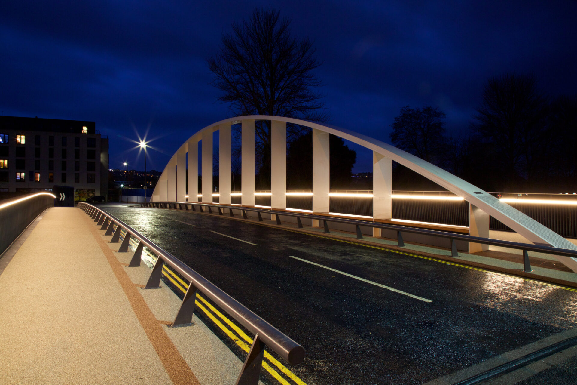 Destructor bridge lit up against a dark night sky