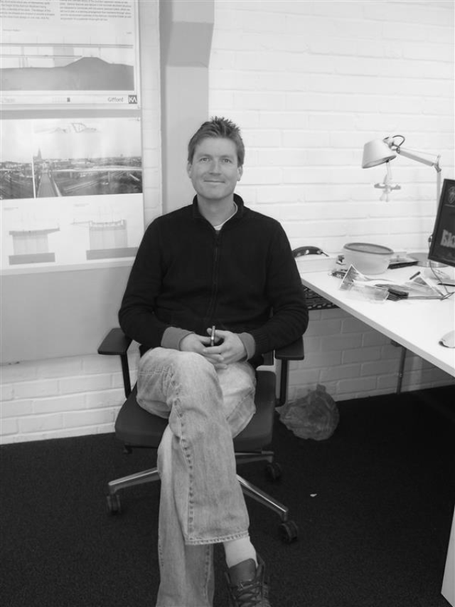 Sam white sitting down in the studio