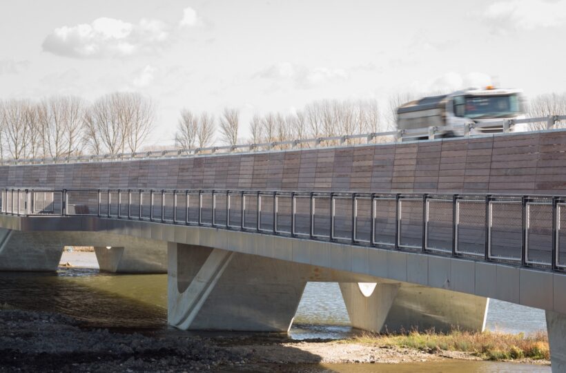 Lorry travelling at speed along road above walkway on Ely Bypass