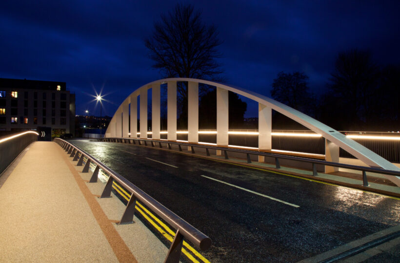 Destructor bridge lit up against a dark night sky