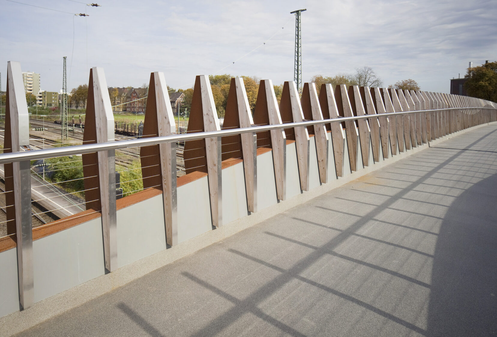 Deck view and view looking onto railway tracks and beyond from Opladen foot and cycle bridge