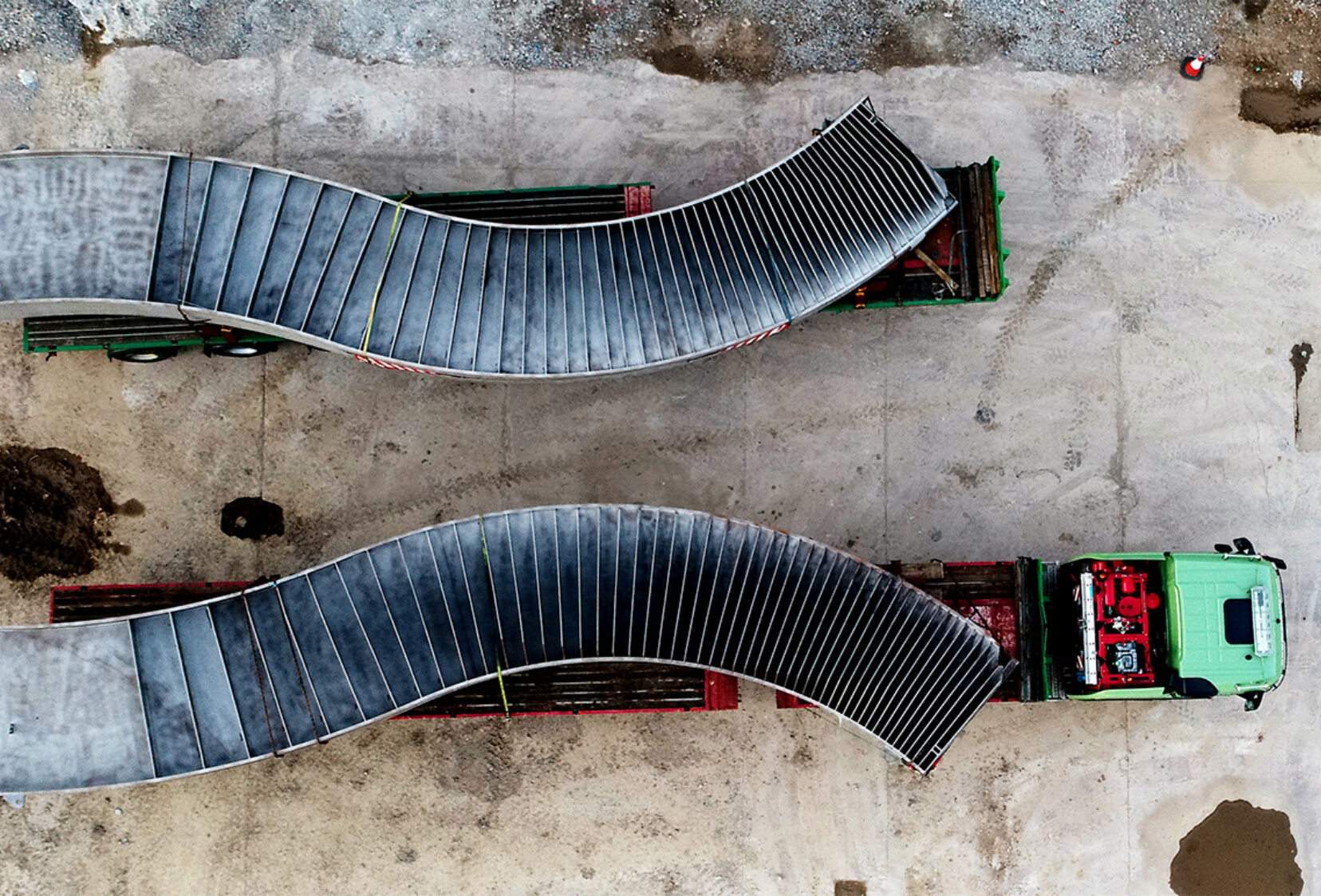 Aerial view looking down at the bridge curves on the back of transporters