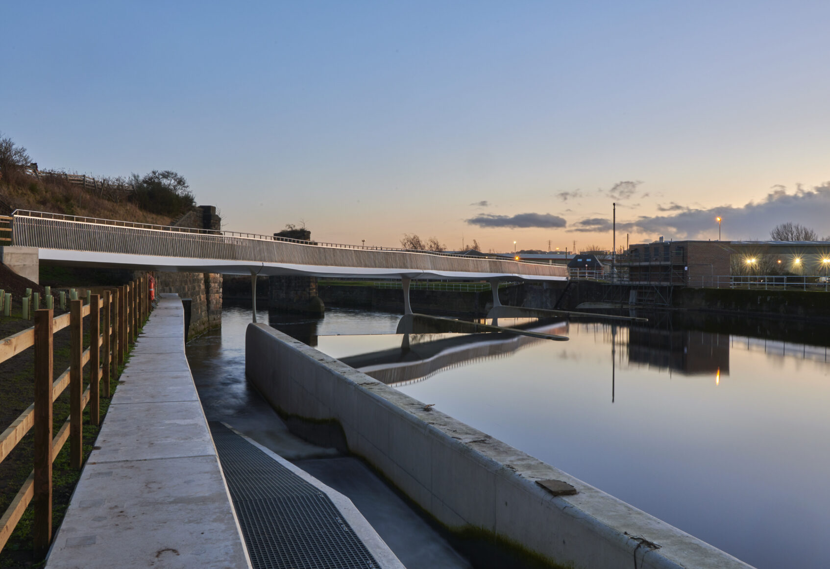 Foot and cycle bridge in Leeds crossing the River Aire, designed by Knight Architects
