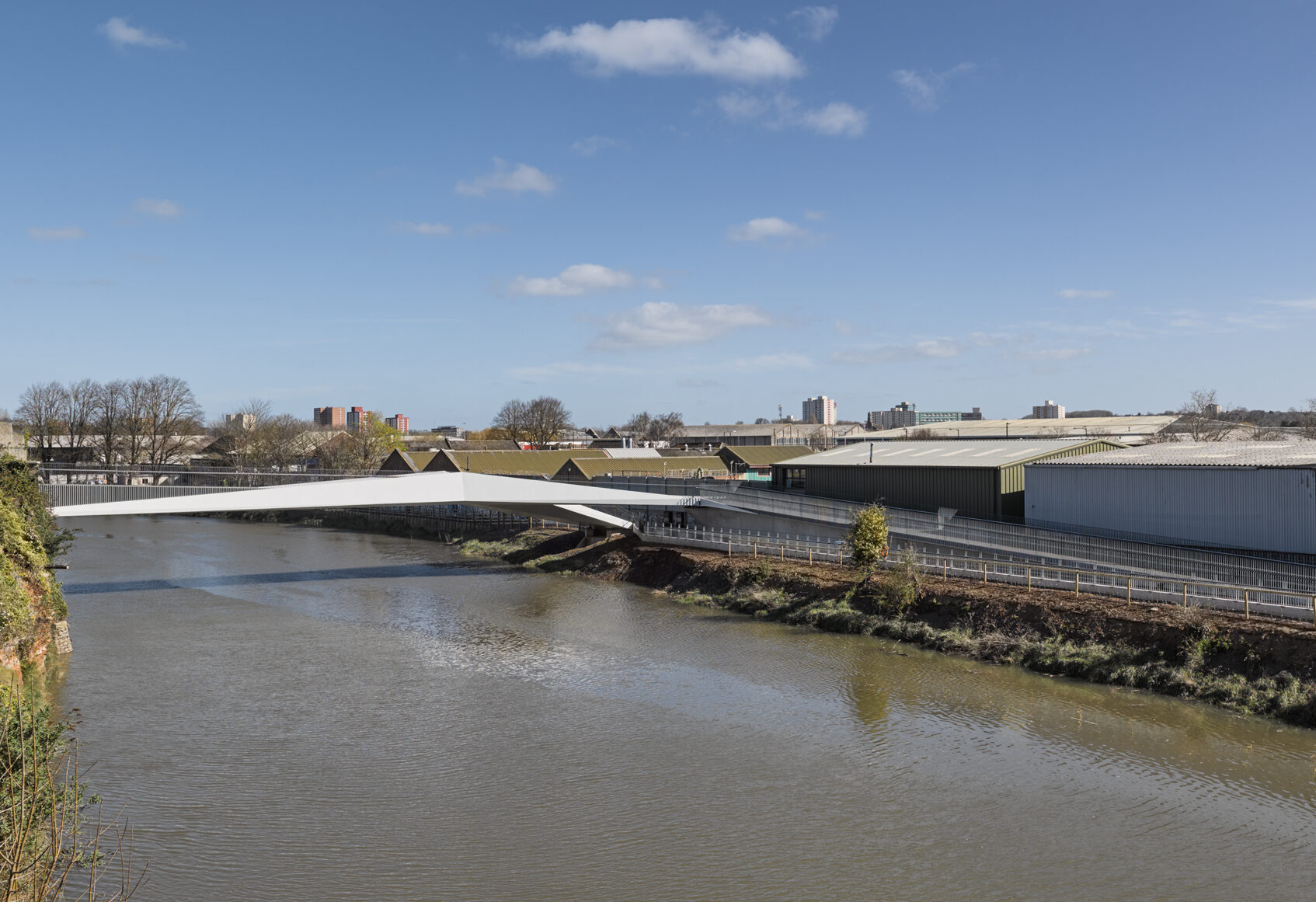 Footbridge in distance crossing River Avon in Bristol